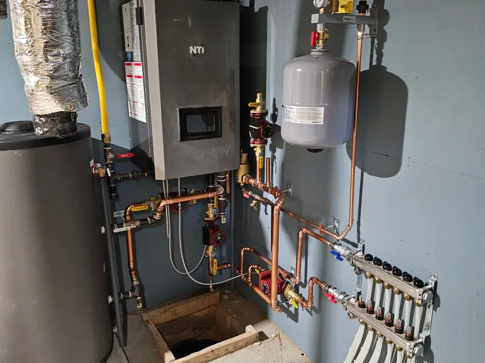NTI high-efficiency boiler with a copper radiant manifold in a Simcoe County utility room