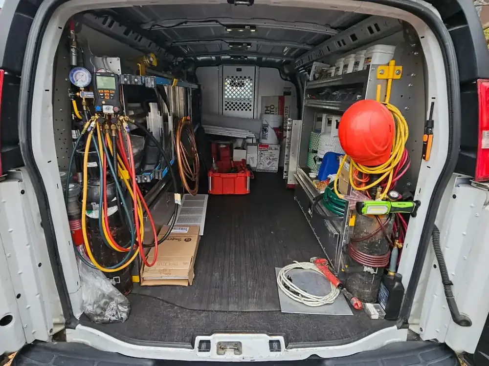 District Air Systems service van loaded with gauges, refrigerant and parts for same-day HVAC calls in Innisfil